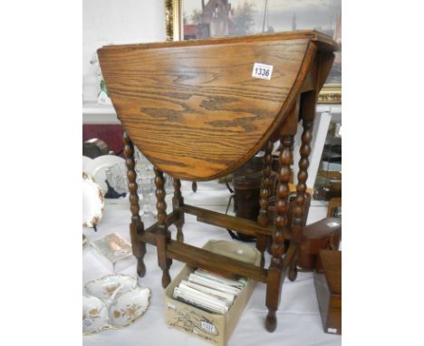 A small oak gateleg table with bobbin turned legs