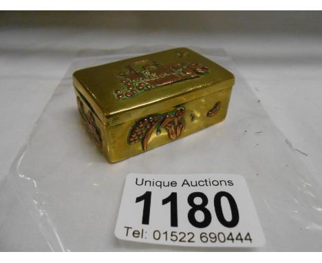 An old Chinese snuff box with copper decoration