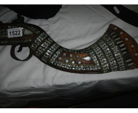 An antique Turkish flintlock rifle inlaid with mother of pearl