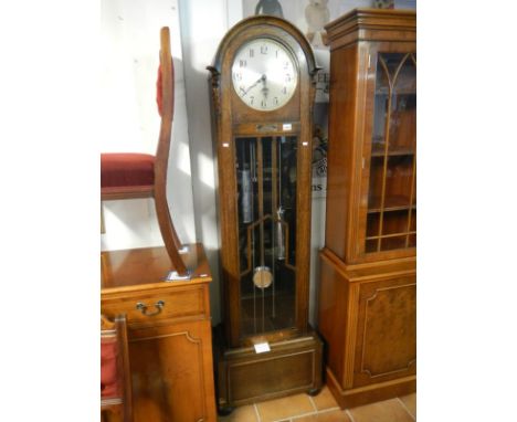 A 1930's oak long case clock with Westminster chime