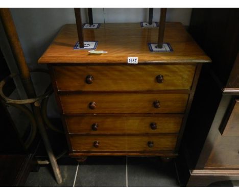 A Victorian mahogany commode in the form of a 4 drawer chest