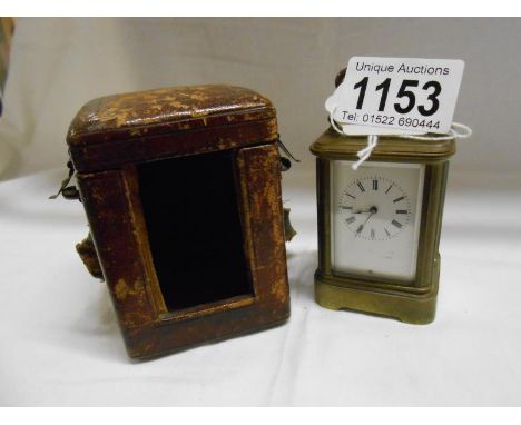 A small cased brass carriage clock (makers name worn from face)