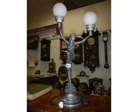 An art deco style twin lamp figural table lamp