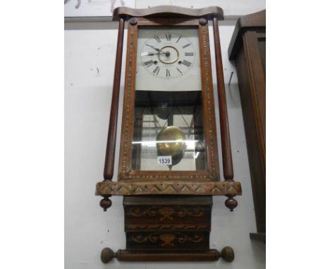 A Victorian inlaid wall clock