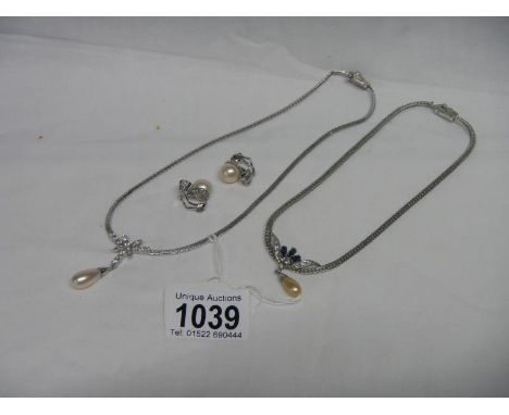 A Majorca pearl pendant with earrings and one other necklace