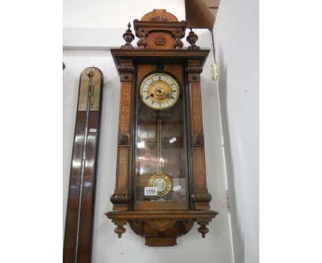 A Victorian inlaid wall clock
