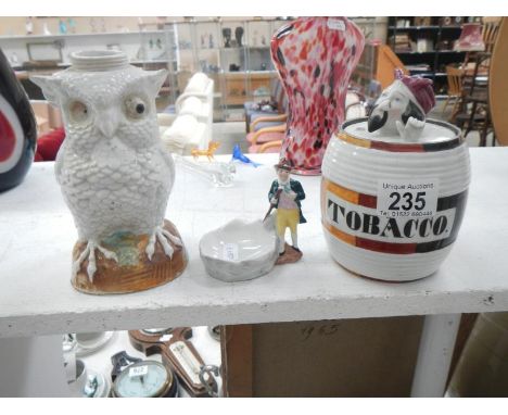 A 19th century Continental porcelain owl oil lamp & tobacco jar (both A/F) & a pipe stand