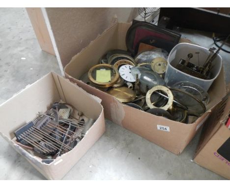 A quantity of clock parts including mechanisms & glass etc.