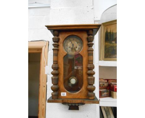 An Edwardian sprung wall clock