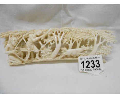An antique carved ivory of a hunting scene signed Emson Mujuru