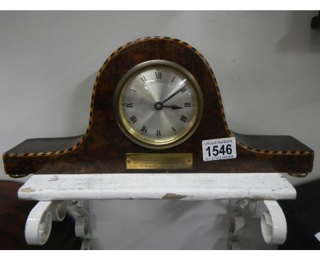 An inlaid mantel clock