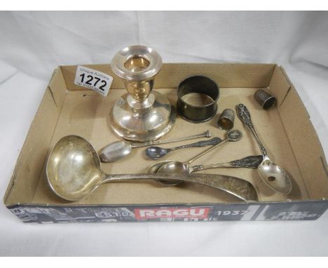 A silver ladle, 5 silver spoons, 2 silver thimbles, a silver napkin ring and a silver candlestick