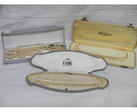 A double strand pearl necklace with 9ct gold clasp, a triple strand pearl necklace with silver clasp and 2 others