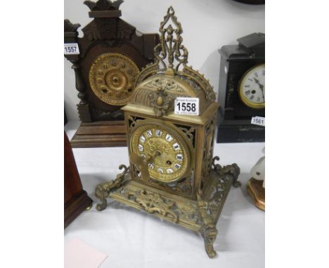 A Victorian brass mantel clock