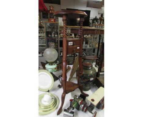 A mahogany tripod pot stand with 2 drawers
