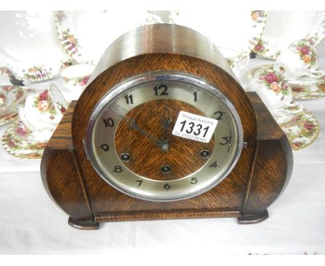 An oak mantle clock