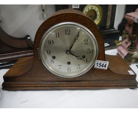 An oak mantel clock