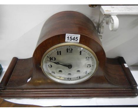 A large mahogany mantel clock