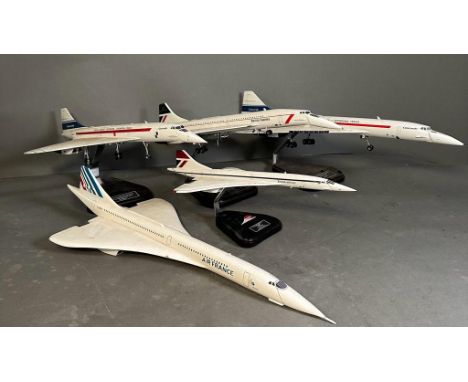 Concorde interest: A selection of five model Concorde planes on mounts various conditions.