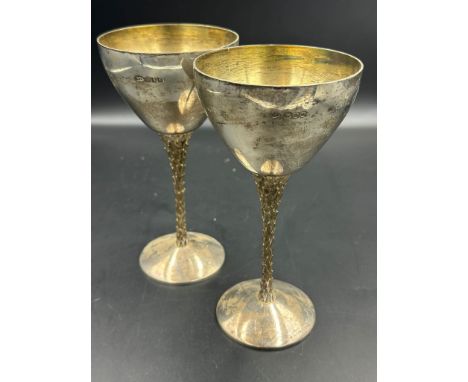 Two silver wine goblets on gilt textured stems, hallmarked for London 1978 Stuart Devlin (Approximate Total Weight 430g) H 17