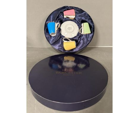 A boxed set of four Royal Worcester commemorative coffee cans and saucers 