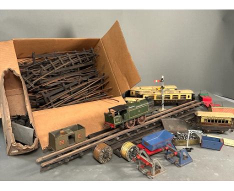 A Selection of tin model railway track, rolling stock an buildings 