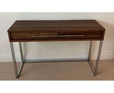 A console table on chrome legs and drawers to centre (110cm x 35cm x 72cm)