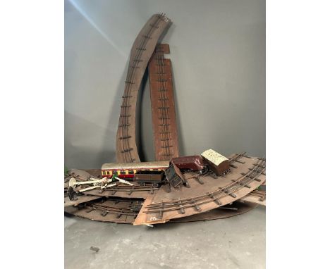 A selection of vintage model railway track, rolling stock and an engine 