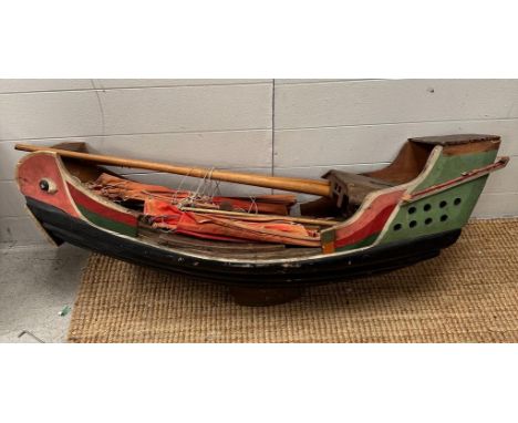 A Vintage Chinese Junk model boat wooden with red sails.
