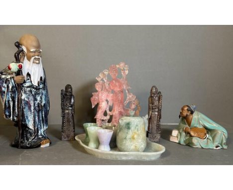 A selection of Chinese items to include two stone figures, two china figures, an AF rose quartz statue on wooden base, and a 