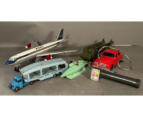 A selection of play worn Diecast vintage toys to include A BOAC aeroplane, a submarine and a Dinky transporter 