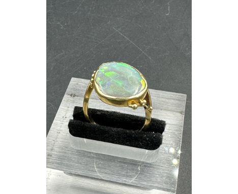 An 18ct gold and opal ring, approximate total weight 6.7g Size N