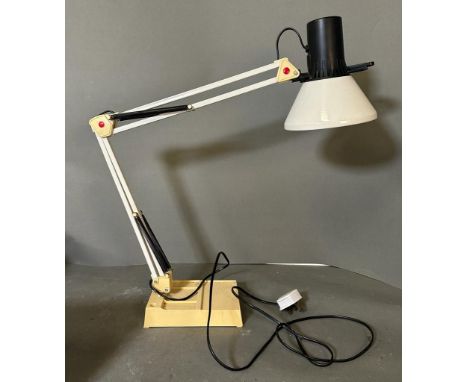 An angle poise desk lamp
