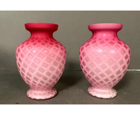 A pair of pink diamond quitted satin glass vases 