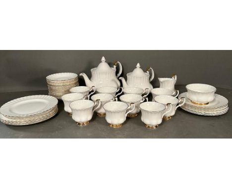 A part Royal Albert Val D'or tea service to include two tea pots, cups and saucers and side plates