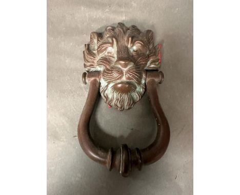 A vintage brass lions head knocker 