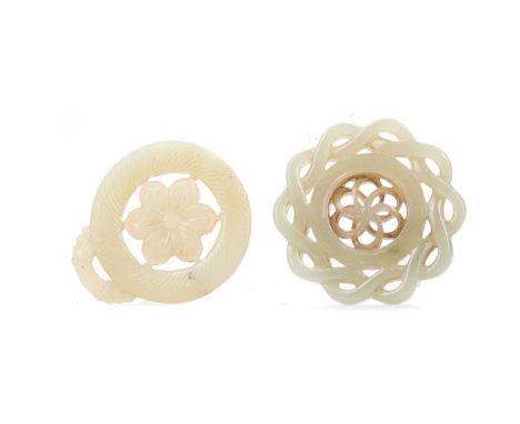 SIX CHINESE JADE AMULETS,of largely circular form, including floral and character carving, the widest 5.5cm wide (6)Amulet wi