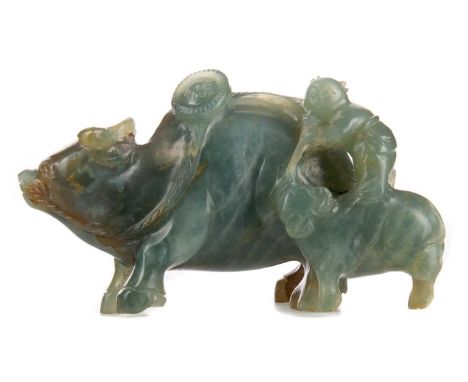 CHINESE DARK CELADON JADE CARVING OF A WATER BUFFALO AND YOUNG,modelled with attendant figure, with reddish-brown inclusions,