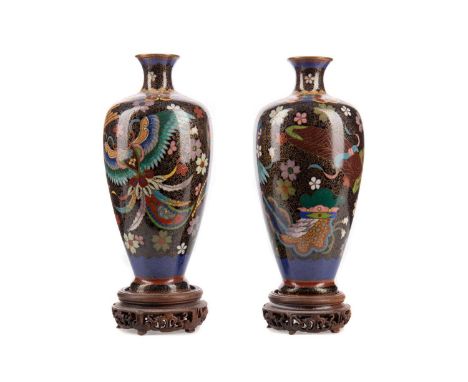PAIR OF LATE 19TH CENTURY CHINESE CLOISONNE VASES,decorated with birds and flower heads on a black ground, of baluster form, 