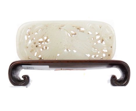 CHINESE PALE CELADON JADE CARVING,pierced and carved in bas-relief with a bird of paradise amongst foliage, 8.5cm x 4.8cm, on