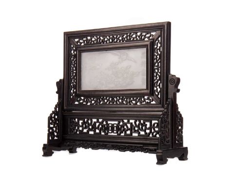 CHINESE WHITE JADE TABLE SCREEN,carved in relief with two birds amongst blossoming peony branches, bearing four character Qia