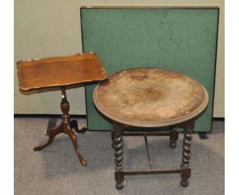 A folding card table and two others