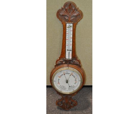 A 19th century carved oak barometer
