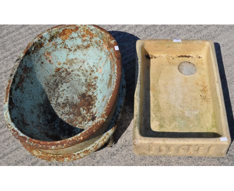 A child's vintage metal bath and ceramic squared sink