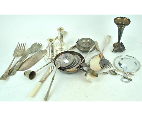A silver plated candlestick and other items