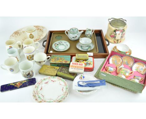 A collection of assorted commemorative wares, bone china and ceramics along with vintage advertising tins. 
