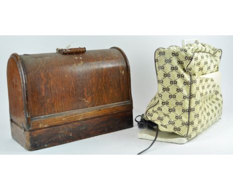 Two sewing machines, an electric one and a manual 