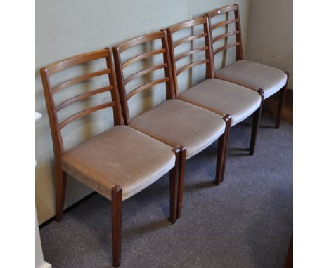 A set of four retro vintage teak wood dining chairs with ladder backs , 84cm high