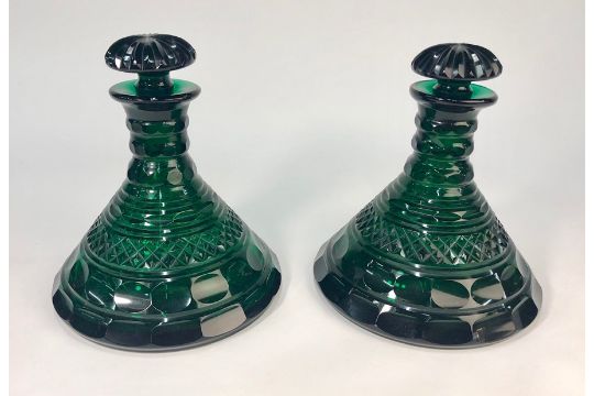 A pair of Regency Bristol green glass ship's decanters with mushroom ...