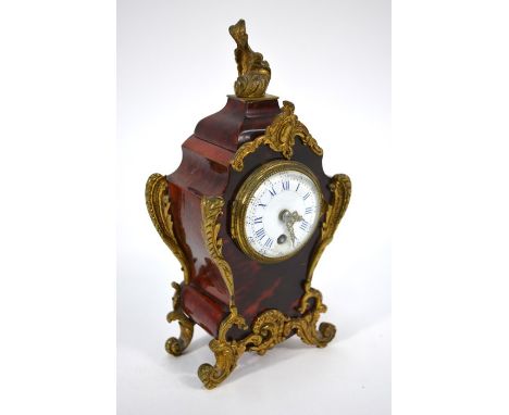 A 19th/20th century gilt metal mounted tortoiseshell mantel clock, the eight-day movement with white enamelled dial (damaged)